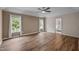 The home features this large bedroom with beautiful hardwood floors and a connecting bathroom at 3653 Range Rd, Stem, NC 27581