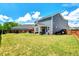 Expansive backyard with a patio, hot tub, and outdoor seating, perfect for entertaining at 45 Iris Dr, Youngsville, NC 27596