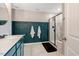 Elegant bathroom features a blue paneled accent wall, a glass shower and a spacious vanity at 45 Iris Dr, Youngsville, NC 27596