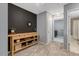 Stylish bedroom with a striking accent wall, plush carpet, and a designer console table at 45 Iris Dr, Youngsville, NC 27596
