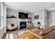 A cozy living room features a fireplace, comfortable seating, and a well-decorated space for relaxation and entertainment at 45 Iris Dr, Youngsville, NC 27596
