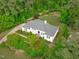 Aerial view of this beautiful home showcasing mature trees, lush landscaping, and a private setting at 4830 North Hills, Raleigh, NC 27612
