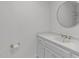 Clean, modern bathroom with white cabinets, granite countertop, and gold fixtures at 4830 North Hills, Raleigh, NC 27612