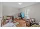 Bedroom featuring hardwood floors and a window with natural light at 4830 North Hills, Raleigh, NC 27612