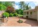 Inviting brick courtyard with garden, perfect for outdoor relaxation and entertaining at 4830 North Hills, Raleigh, NC 27612