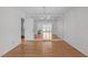 Bright dining room features hardwood floors, a mirrored wall, and views into the living room and kitchen at 4830 North Hills, Raleigh, NC 27612