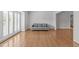 Bright living room with hardwood floors and plantation shutters allowing for natural light at 4830 North Hills, Raleigh, NC 27612