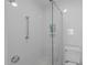 Modern bathroom with a glass-enclosed shower and tiled walls at 4830 North Hills, Raleigh, NC 27612