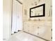 Bright bathroom showcasing a white vanity with plenty of storage and a framed mirror at 5021 Lansdowne Dr, Durham, NC 27712