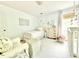 This Bedroom features a comfortable armchair, a white crib, and plenty of natural light at 5021 Lansdowne Dr, Durham, NC 27712