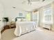 Bright bedroom features a comfortable bed, plenty of natural light, and stylish storage options at 5021 Lansdowne Dr, Durham, NC 27712