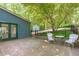 Back yard features a wood deck, black metal fence, and a cozy seating area at 603 Gentry Ln, Hillsborough, NC 27278