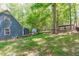 The spacious backyard provides a serene view of the home's exterior and surrounding landscape at 603 Gentry Ln, Hillsborough, NC 27278