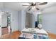 Bright bedroom featuring an open door, stylish fan, a window, and unique design at 603 Gentry Ln, Hillsborough, NC 27278