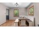 Charming dining area with a built-in bench and wood table, creating a warm and inviting space for Gathering meals at 603 Gentry Ln, Hillsborough, NC 27278