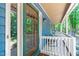 The inviting front porch offers seating with charming views of the surrounding greenery at 603 Gentry Ln, Hillsborough, NC 27278