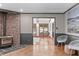 Inviting living room with a cozy fireplace, hardwood floors, and an open doorway to a sunlit room at 603 Gentry Ln, Hillsborough, NC 27278