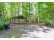 Open air structure offering shade, perfect for outdoor relaxation or entertaining in a large backyard at 603 Gentry Ln, Hillsborough, NC 27278