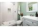 Clean bathroom featuring a large shower, white vanity with sink, and window at 606 Chalice St, Durham, NC 27705