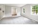 Cozy bedroom with neutral carpet, ample natural light, and access to a walk-in closet at 606 Chalice St, Durham, NC 27705