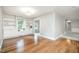 Elegant dining area with hardwood floors, built-in cabinets, and bright natural lighting at 606 Chalice St, Durham, NC 27705