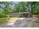 Charming home exterior featuring an attached carport and well-maintained landscaping at 606 Chalice St, Durham, NC 27705