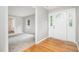 Inviting foyer with hardwood floors transitioning to carpet in the adjacent room at 606 Chalice St, Durham, NC 27705