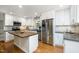 Well-equipped kitchen boasting stainless steel appliances and a central wooden island at 606 Chalice St, Durham, NC 27705