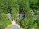 Aerial view of home nestled among mature trees at 640 St Vincent Dr, Holly Springs, NC 27540