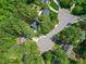 Expansive aerial view of a tree-filled neighborhood with well-maintained homes and cul-de-sac streets at 640 St Vincent Dr, Holly Springs, NC 27540