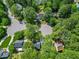 Gorgeous aerial view showcases a home surrounded by mature trees in a well-maintained neighborhood at 640 St Vincent Dr, Holly Springs, NC 27540