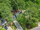 Aerial view of a private home surrounded by lush trees, offering a serene and secluded setting at 640 St Vincent Dr, Holly Springs, NC 27540