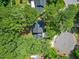 Aerial view of a home nestled among mature trees, on a cul-de-sac at 640 St Vincent Dr, Holly Springs, NC 27540