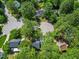 Stunning aerial view of a home nestled within a lush, green, tree-filled residential neighborhood on a cul-de-sac at 640 St Vincent Dr, Holly Springs, NC 27540