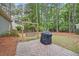 Backyard featuring a patio with swing and grill surrounded by trees and grass at 640 St Vincent Dr, Holly Springs, NC 27540