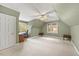 Spacious carpeted bedroom area with a vaulted ceiling and multiple windows providing natural light at 640 St Vincent Dr, Holly Springs, NC 27540