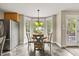 Breakfast nook with bay window letting in lots of natural light at 640 St Vincent Dr, Holly Springs, NC 27540