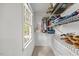 Walk-in closet with wire shelving and a window for natural light at 640 St Vincent Dr, Holly Springs, NC 27540