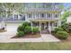 Charming two-story home featuring a welcoming front porch, attached garage, and beautifully landscaped yard at 640 St Vincent Dr, Holly Springs, NC 27540