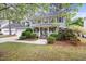Inviting two-story home with a cozy front porch, attached garage, and well-maintained landscaping at 640 St Vincent Dr, Holly Springs, NC 27540