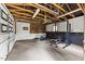 Spacious garage features high ceilings, exposed beams, and workout equipment for fitness enthusiasts at 640 St Vincent Dr, Holly Springs, NC 27540