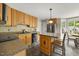 Charming kitchen with an island and stainless steel refrigerator at 640 St Vincent Dr, Holly Springs, NC 27540