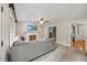 Comfortable living room features a fireplace and opens to other rooms at 640 St Vincent Dr, Holly Springs, NC 27540
