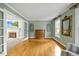 Elegant living room featuring hardwood floors, neutral walls, and large windows for natural light at 640 St Vincent Dr, Holly Springs, NC 27540