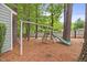 Backyard playground featuring swing set and slide, perfect for outdoor fun at 640 St Vincent Dr, Holly Springs, NC 27540