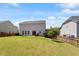 Spacious backyard featuring a well-maintained lawn and a cozy patio area, perfect for outdoor gatherings and relaxation at 713 Apalachia Lake Dr, Fuquay Varina, NC 27526