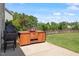 Patio featuring an outdoor kitchen with a built-in grill and plenty of prep space, ideal for entertaining guests in the backyard at 713 Apalachia Lake Dr, Fuquay Varina, NC 27526