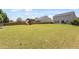 Large backyard with a swing set and plenty of space for to run around and play in this Gathering-friendly outdoor setting at 713 Apalachia Lake Dr, Fuquay Varina, NC 27526