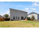 Expansive backyard with lush lawn, patio, and privacy fence, with a view of the home's exterior at 713 Apalachia Lake Dr, Fuquay Varina, NC 27526