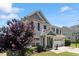 Well-maintained home with a landscaped front yard, two-car garage, and classic architectural details at 713 Apalachia Lake Dr, Fuquay Varina, NC 27526